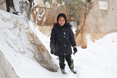 Syrian refugee children playing in the snow that fell on the camp near the syrian-turkish border.