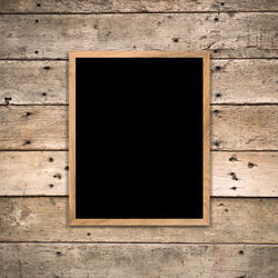 High angle view of blank blackboard on wooden table