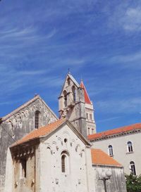 Low angle view of church against blue sky