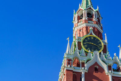 Low angle view of clock tower against sky