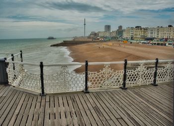 Scenic view of sea against buildings in city