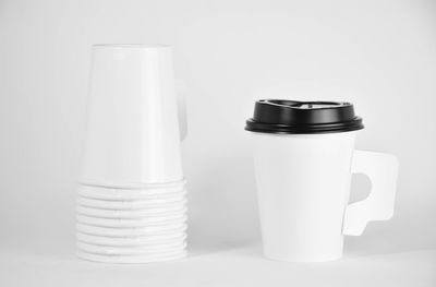 Close-up of tea cup on table against white background