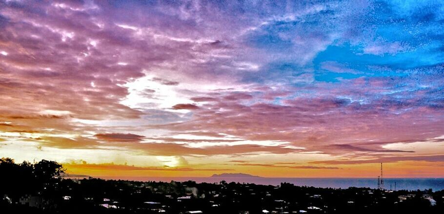 cityscape, city, built structure, architecture, cloud - sky, building exterior, sky, illuminated, dramatic sky, scenics, city life, blue, residential district, outdoors, wide shot, beauty in nature, aerial view, no people, romantic sky, tranquility, majestic, town, multi colored