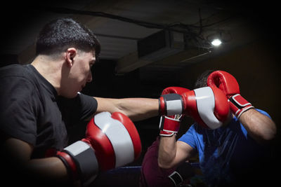 Two boxers training on a ring