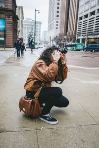 Woman standing on city street