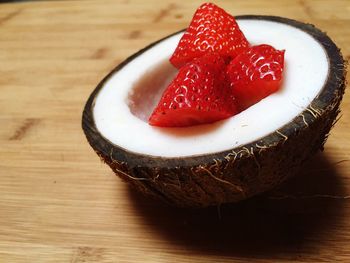 Close-up of strawberry in coconut bowl