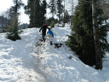 Full length of person on snow covered landscape