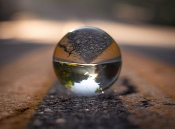 Close-up of crystal ball on street 