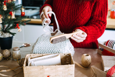 Midsection of woman holding gift