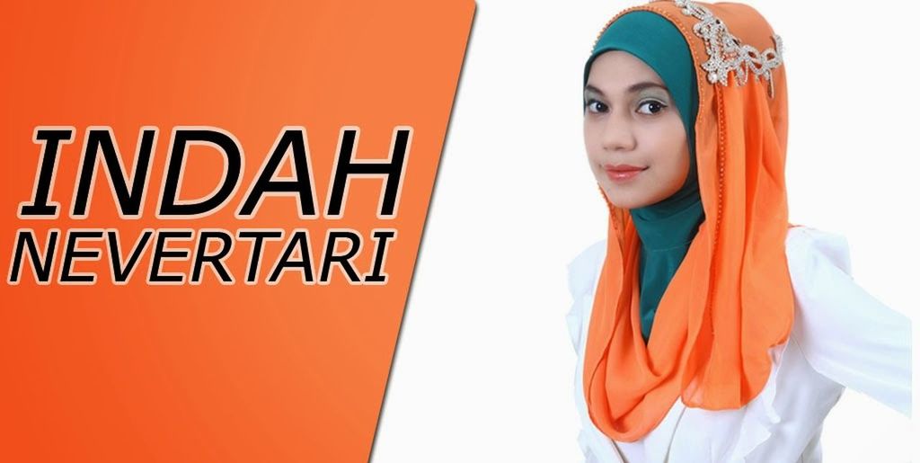 PORTRAIT OF YOUNG WOMAN STANDING AGAINST WHITE BACKGROUND