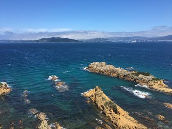 High angle view of sea against blue sky