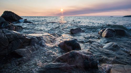 Scenic view of sea against sky during sunset