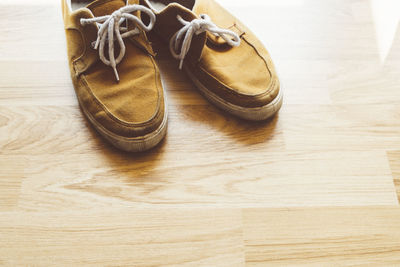 High angle view of shoes on wooden table