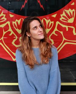 Portrait of beautiful young woman standing outdoors