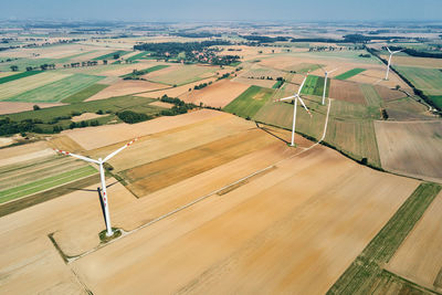 Windmill turbine in the field at summer day. rotating wind generator