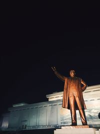 Low angle view of statue at night