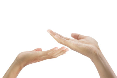 Close-up of human hand against white background