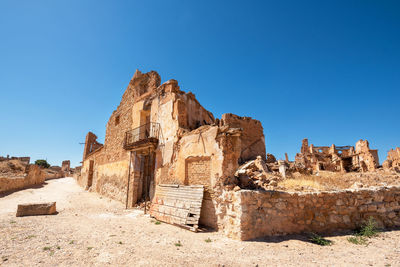 Old ruins against clear blue sky