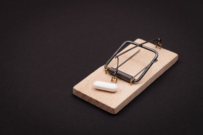 High angle view of telephone on table against black background
