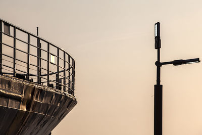 Cropped ship against clear sky at sunset