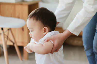 Mother and cute baby at home