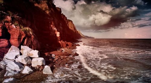 Scenic view of sea against cloudy sky