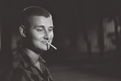 Portrait of man smoking cigarette