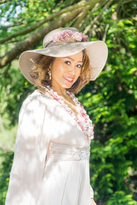 Portrait of young woman wearing hat