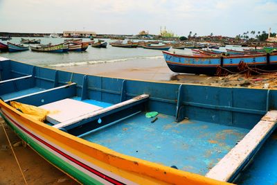 Boats moored at riverbank