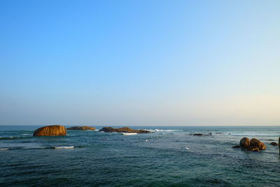 View of calm sea against clear sky