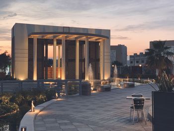 Buildings in city at sunset
