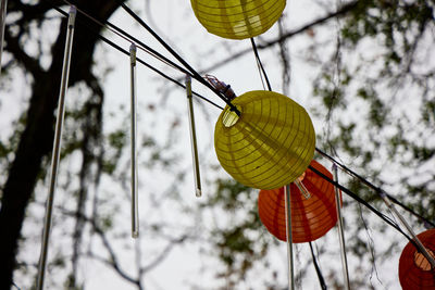 Low angle view of balloons against sky