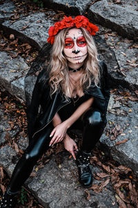 Closeup portrait of calavera catrina. young woman with sugar skull makeup. dia de los muertos. day