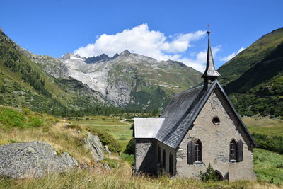 Scenic view of landscape and mountains against sky