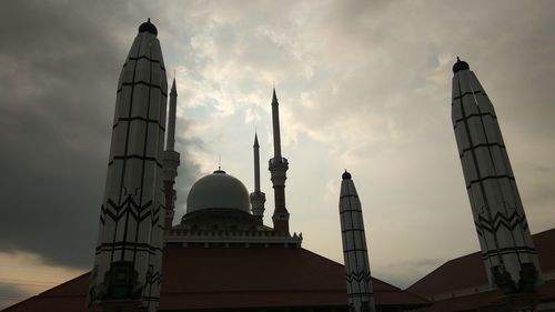 Low angle view of building against sky at dusk