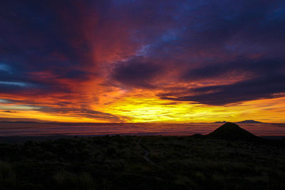 Scenic view of dramatic sky during sunset