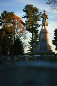 Low angle view of statue against sky