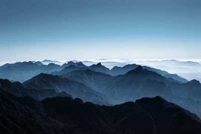 Scenic view of mountains against clear blue sky