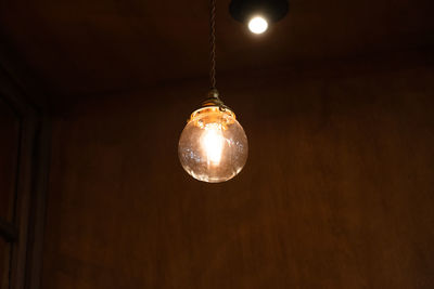 Low angle view of illuminated light bulb