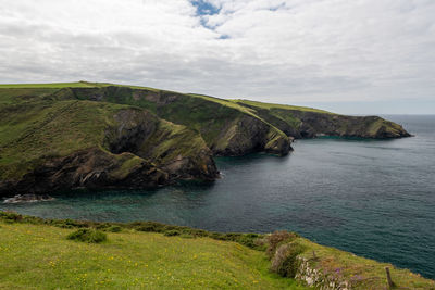 View of the rugged coastline around the fishing village of port isaac in cornwall