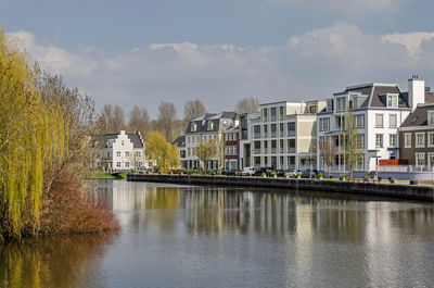 New neighbourhood with architecture in retro style on the bank of the river vecht