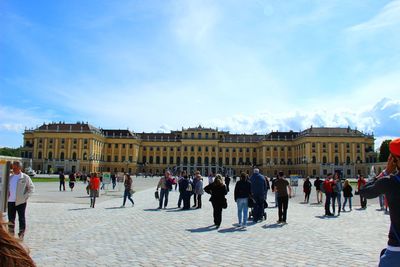 Tourists in front of building