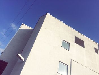 Low angle view of building against blue sky