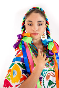 Portrait of a beautiful young woman over white background