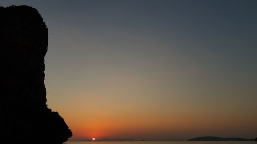 Scenic view of sea against clear sky during sunset