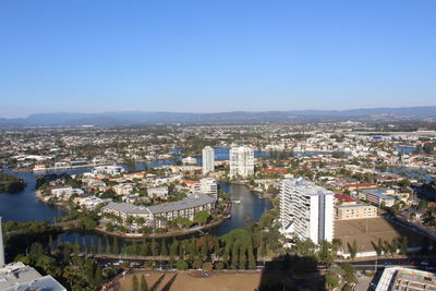 High angle view of buildings against clear blue sky