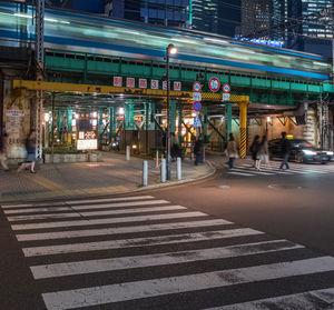 View of road sign at night