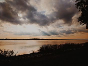 Scenic view of lake against sky during sunset