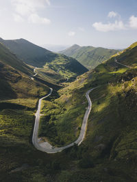 Winding road up to the mountains in valles pasiegos cantabria, spain