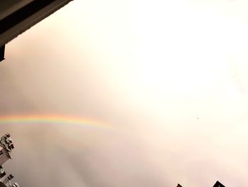 Low angle view of rainbow in sky